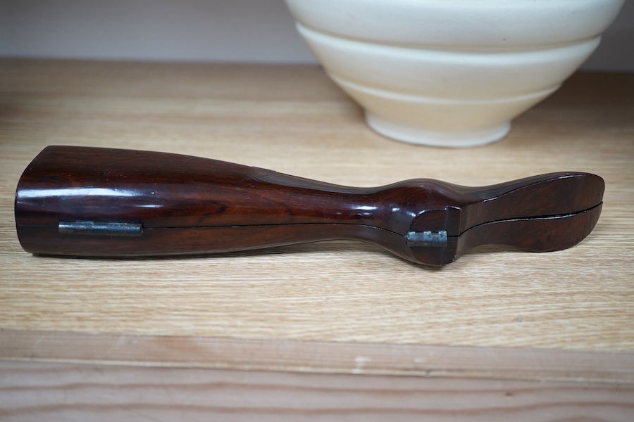 A Victorian rosewood 'ladys foot' etui holding a pair of steel bootpulls with additional tools to the handle, 26.5cm. Condition - good